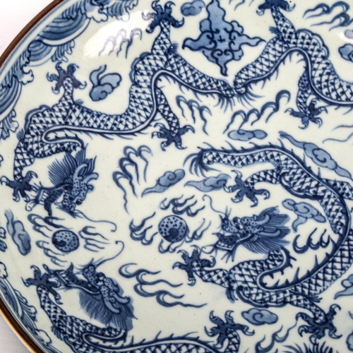 1252 - A Chinese blue and white porcelain dragon bowl, 6 character mark, diameter 28cm