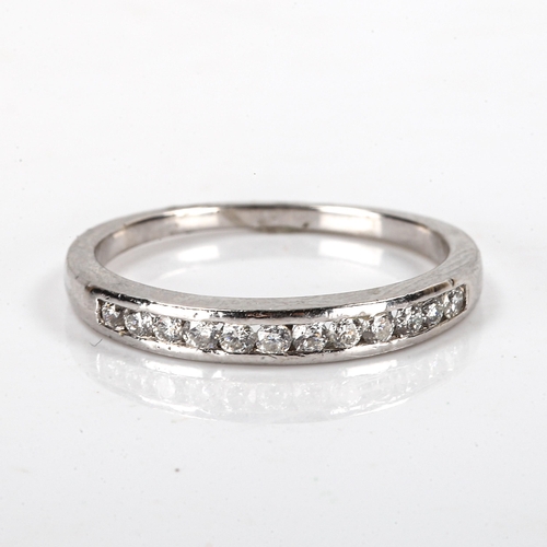 174 - A modern platinum diamond half eternity ring, set with modern round brilliant-cut diamonds, total di... 