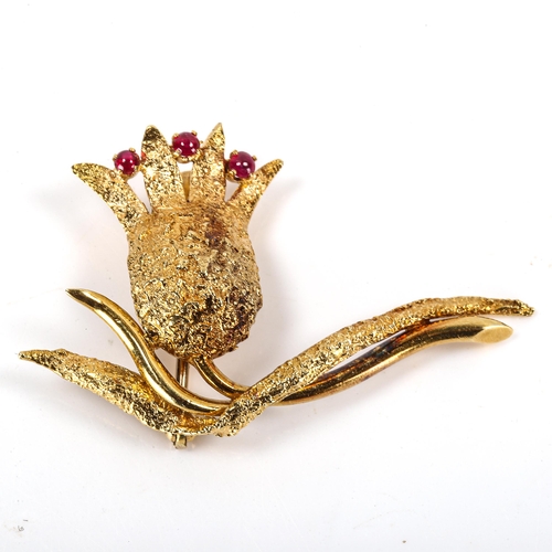 178 - A late 20th century 18ct gold ruby floral brooch, textured and polished settings with round cabochon... 