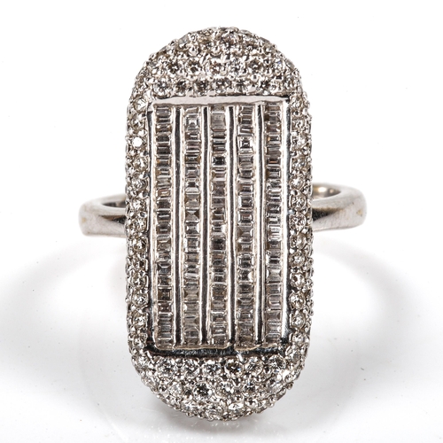 179 - A modern 18ct white gold diamond cluster dress ring, kidney-shaped panel set with modern round brill... 