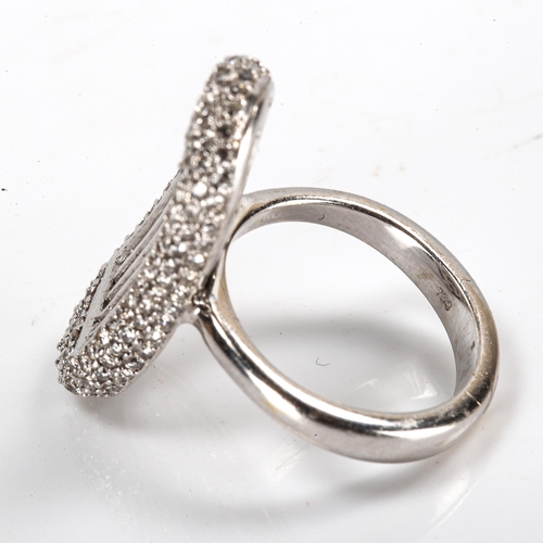 179 - A modern 18ct white gold diamond cluster dress ring, kidney-shaped panel set with modern round brill... 