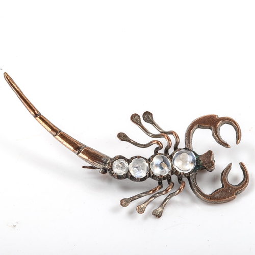 180 - A Victorian gilt-metal moonstone figural scorpion brooch, length 54.4mm, 3.5g