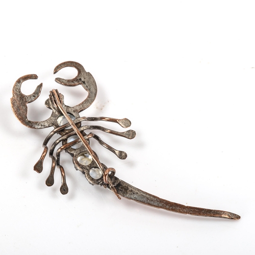 180 - A Victorian gilt-metal moonstone figural scorpion brooch, length 54.4mm, 3.5g