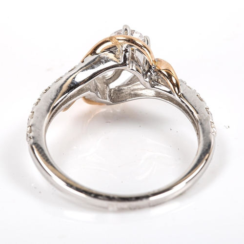 183 - A modern diamond crossover ring, unmarked settings test as 14ct, set with modern round brilliant-cut... 