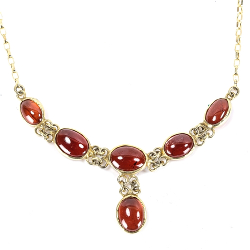 184 - A modern 9ct gold garnet line necklace, set with oval cabochon garnets, necklace length 46cm, 4.6g