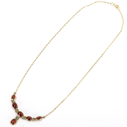 184 - A modern 9ct gold garnet line necklace, set with oval cabochon garnets, necklace length 46cm, 4.6g