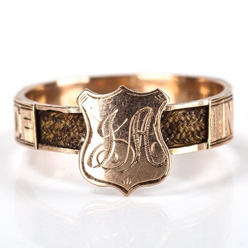 187 - A late 19th century 9ct gold memorial ring, with central shield plaque and In Memory Of open woven h... 