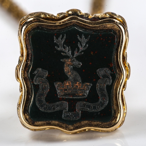 194 - An Antique gilt-metal bloodstone seal fob, on gold plated popcorn link chain, seal with stag head an... 