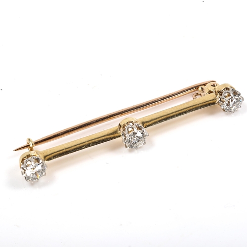 200 - An unmarked gold 3-stone diamond bar brooch, set with round brilliant-cut diamonds, total diamond co... 