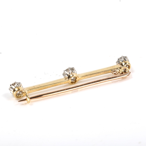 200 - An unmarked gold 3-stone diamond bar brooch, set with round brilliant-cut diamonds, total diamond co... 