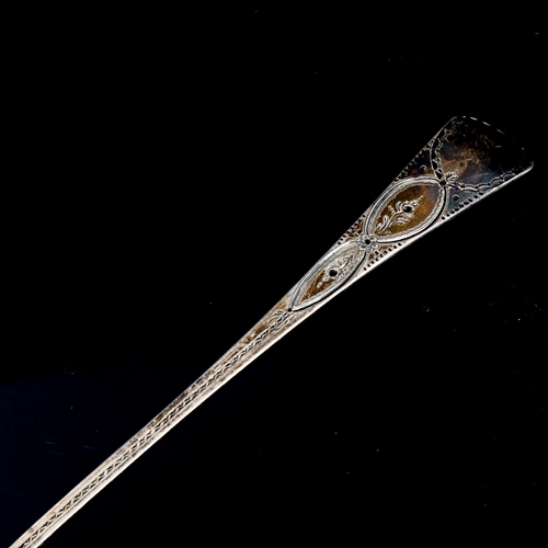 203 - A George III silver Old English pattern soup ladle, bright-cut engraved decoration by Solomon Hougha... 