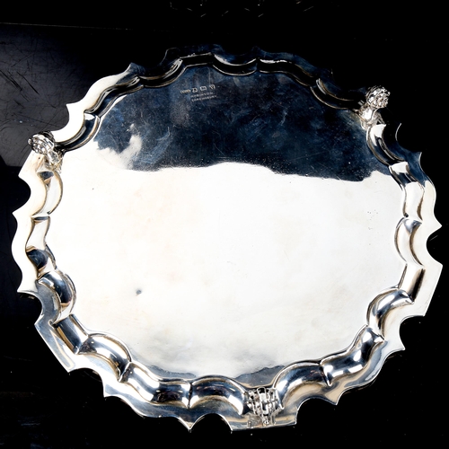 205 - A George VI silver salver, scalloped rim with scrolled acanthus leaf feet, by G Bryan & Co, hallmark... 