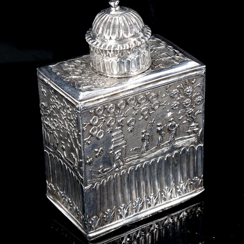 208 - A 17th/18th century Chinese export silver tea caddy, relief embossed decoration, with fluted lid and... 