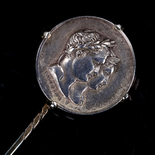 213 - An Antique French commemorative coin stickpin, unmarked gold and silver settings, depicting a portra... 