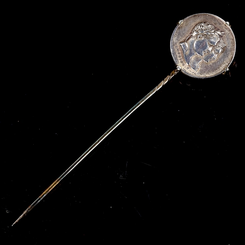 213 - An Antique French commemorative coin stickpin, unmarked gold and silver settings, depicting a portra... 