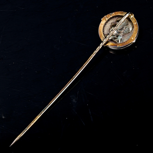 213 - An Antique French commemorative coin stickpin, unmarked gold and silver settings, depicting a portra... 