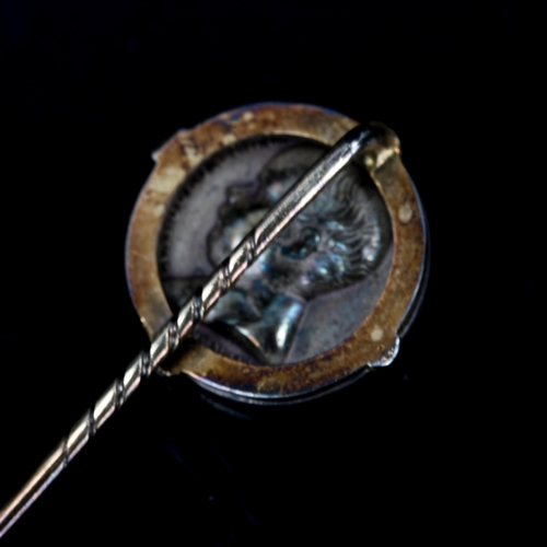 213 - An Antique French commemorative coin stickpin, unmarked gold and silver settings, depicting a portra... 