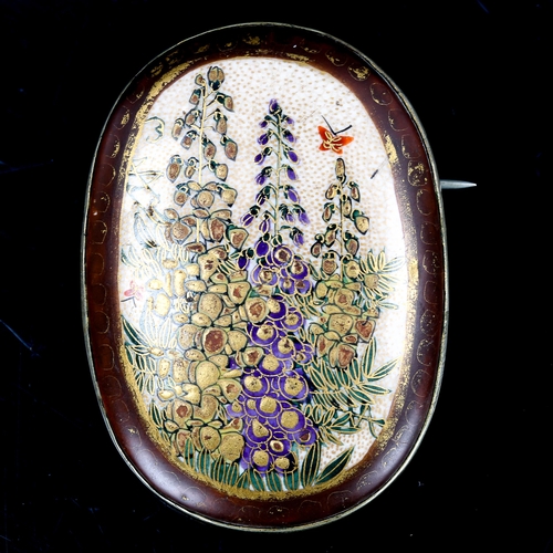 214 - A Japanese Satsuma porcelain panel brooch, hand painted and gilded decoration, with white metal sett... 