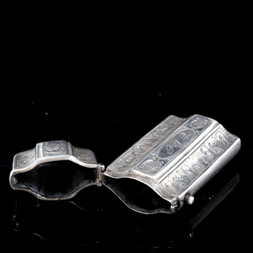 227 - An Antique Dutch silver Vesta case, shaped form with bright-cut engraved decoration, 6cm x 3cm