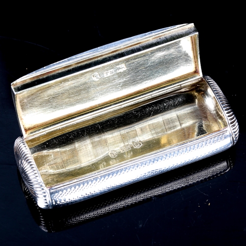 229 - A William IV silver snuffbox, rounded rectangular form with engine turned decoration, invisible hing... 