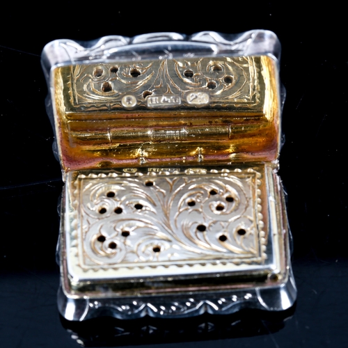 230 - A Victorian silver vinaigrette, shaped rectangular form with engraved foliate decoration, pierced fo... 