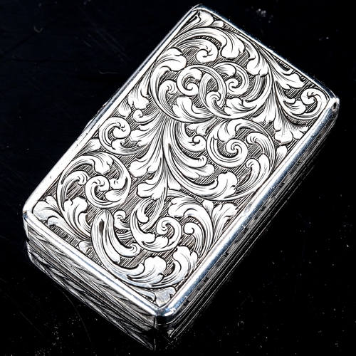 232 - A Victorian silver vinaigrette, rectangular form with allover engraved foliate decoration, pierced a... 