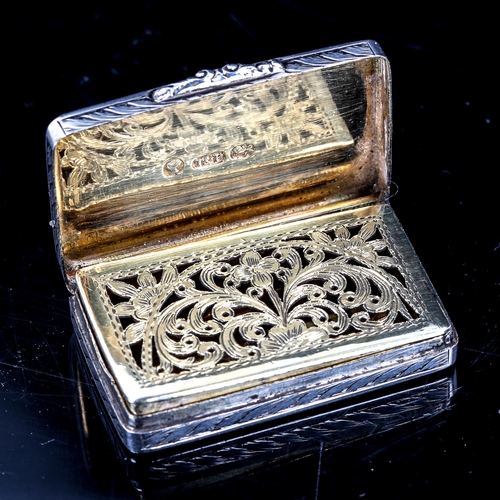 232 - A Victorian silver vinaigrette, rectangular form with allover engraved foliate decoration, pierced a... 