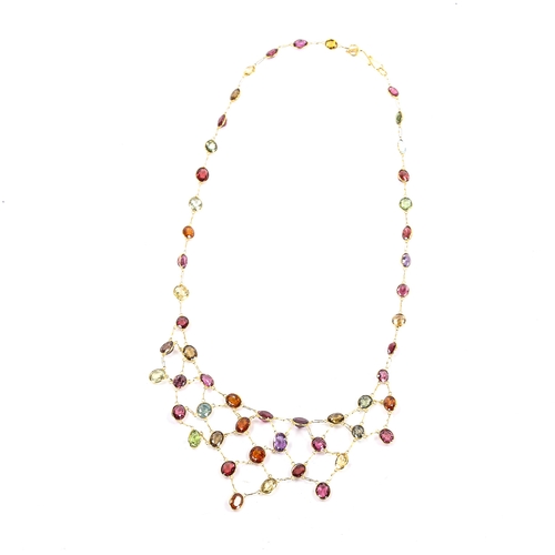 243 - A modern 14ct gold gem set bib necklace, gemstones include amethyst, peridot, garnet, citrine, topaz... 