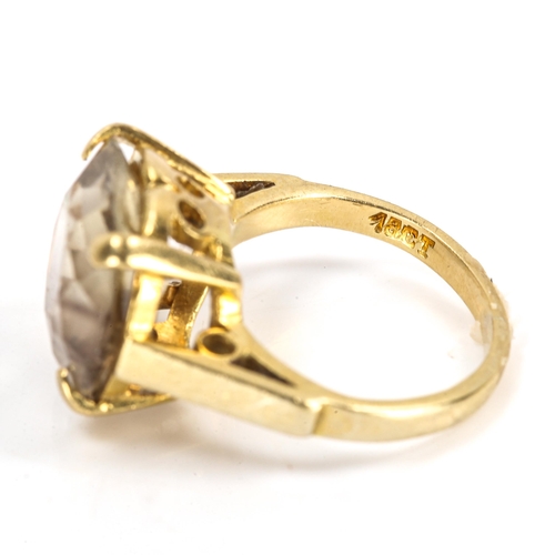 256 - An 18ct gold smoky quartz dress ring, setting height 12.2mm, size F/G, 4.9g