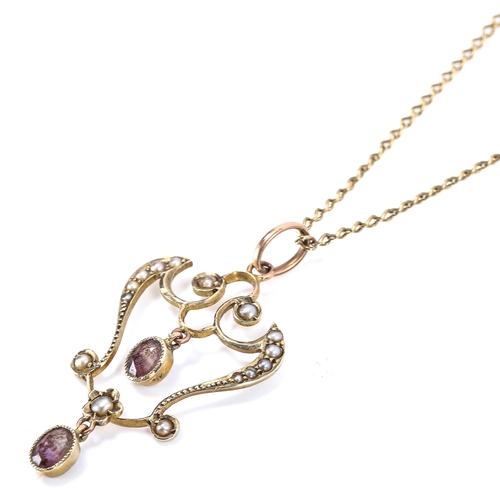 260 - An Edwardian Art Nouveau 9ct gold amethyst and pearl openwork pendant necklace on gilt-metal chain, ... 