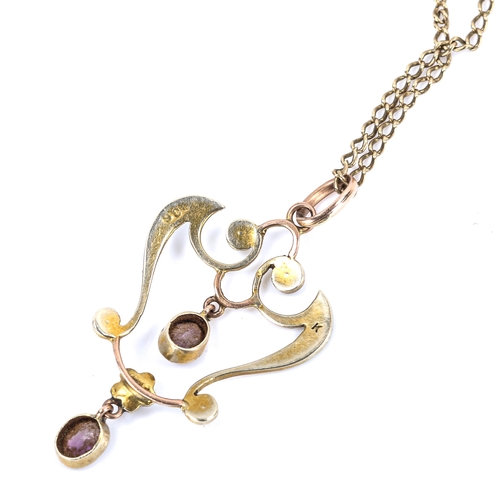 260 - An Edwardian Art Nouveau 9ct gold amethyst and pearl openwork pendant necklace on gilt-metal chain, ... 