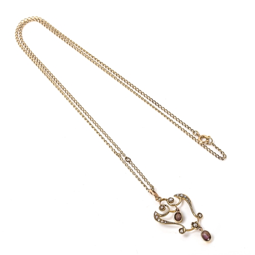 260 - An Edwardian Art Nouveau 9ct gold amethyst and pearl openwork pendant necklace on gilt-metal chain, ... 