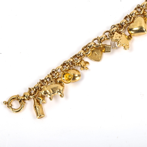 264 - A modern 9ct gold belcher link charm bracelet with 26 charms, bracelet length 18cm, 22.4g gross