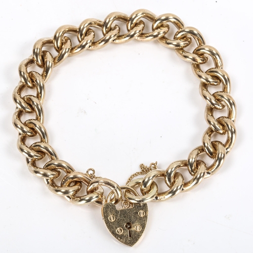 266 - A heavy 9ct gold curb link bracelet, with heart padlock, hallmarks London 1976, bracelet length 17cm... 