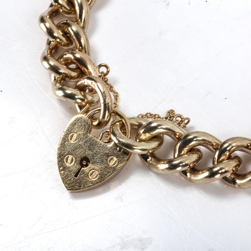 266 - A heavy 9ct gold curb link bracelet, with heart padlock, hallmarks London 1976, bracelet length 17cm... 