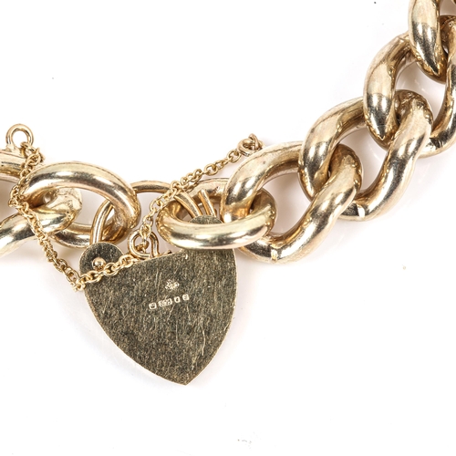 266 - A heavy 9ct gold curb link bracelet, with heart padlock, hallmarks London 1976, bracelet length 17cm... 