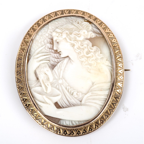 292 - A Victorian shell cameo brooch, depicting Hebe feeding eagle Zeus, relief carved with unmarked rose ... 