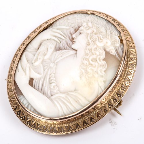 292 - A Victorian shell cameo brooch, depicting Hebe feeding eagle Zeus, relief carved with unmarked rose ... 