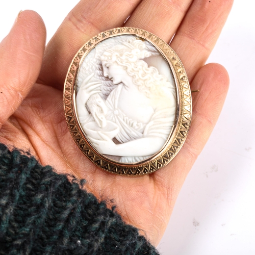 292 - A Victorian shell cameo brooch, depicting Hebe feeding eagle Zeus, relief carved with unmarked rose ... 