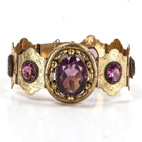 295 - A Victorian gilt-metal amethyst panel bracelet, set with oval mixed-cut amethysts with engraved flor... 