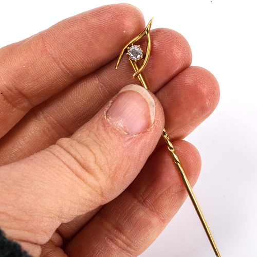 297 - A Victorian unmarked gold diamond wishbone stickpin set with old-cut diamond, head width 13.6mm, 1.6... 