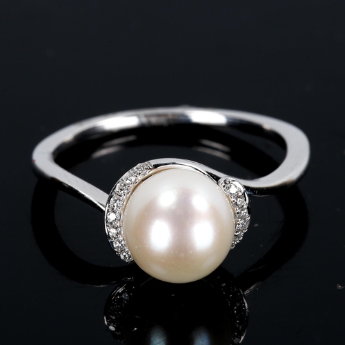 305 - A modern 9ct white gold pearl and diamond crossover ring, set with whole pearl and round brilliant-c... 