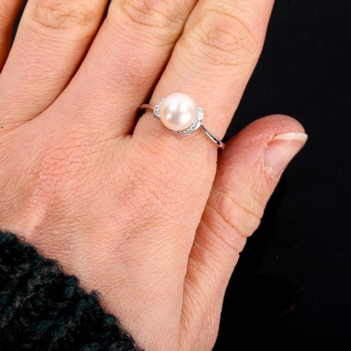 305 - A modern 9ct white gold pearl and diamond crossover ring, set with whole pearl and round brilliant-c... 