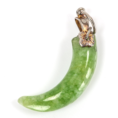 311 - A Chinese carved and polished jade claw design pendant, height excluding bale 24.1mm, 2.3g