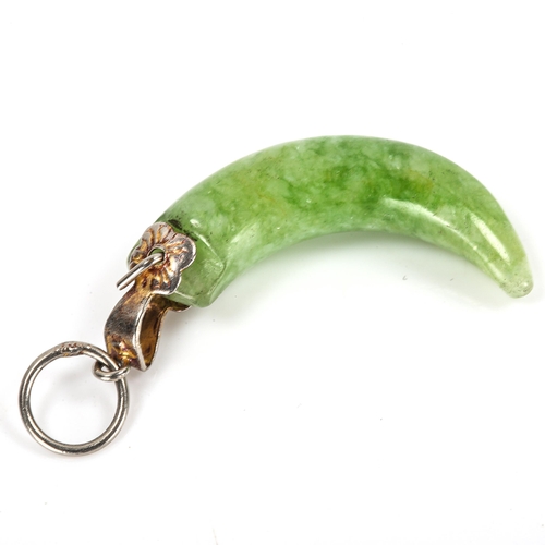 311 - A Chinese carved and polished jade claw design pendant, height excluding bale 24.1mm, 2.3g