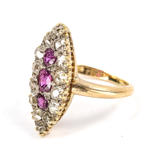 312 - An Edwardian 18ct gold ruby and diamond marquise cluster ring, set with oval and round-cut rubies wi... 