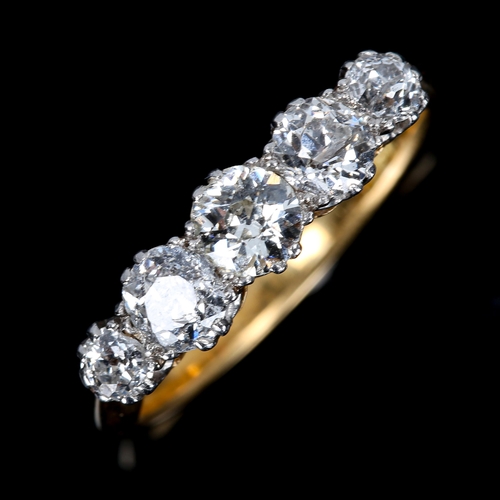 313 - An 18ct gold graduated 5-stone diamond half hoop ring, set with old European-cut diamonds, total dia... 