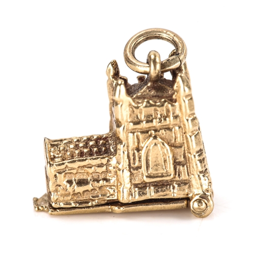 329 - A late 20th century 9ct gold novelty church marriage charm/pendant, opening to reveal bride and groo... 