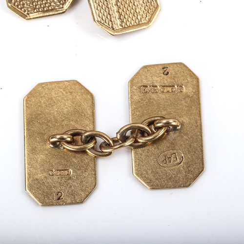 333 - A pair of early 20th century 9ct gold cufflinks, canted rectangular form with engine turned decorati... 