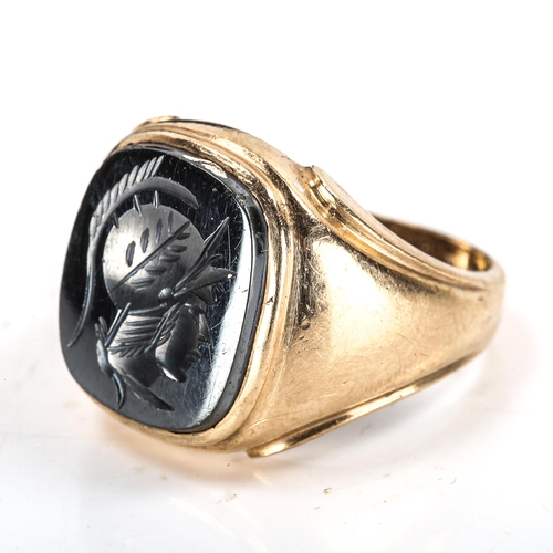 334 - A large 9ct gold haematite seal ring, intaglio carved with centurion profile, import hallmarks Londo... 